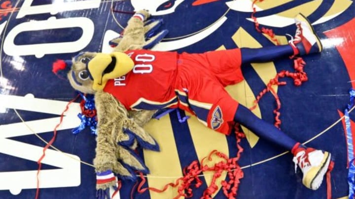 Apr 15, 2015; New Orleans, LA, USA; The Pelicans mascot Pierre the Pelicans makes a angel in streamers following a win against the San Antonio Spurs in a game at the Smoothie King Center. The Pelicans defeated the Spurs 108-103 to earn the 8th seed in the Western Conference Playoffs. Mandatory Credit: Derick E. Hingle-USA TODAY Sports