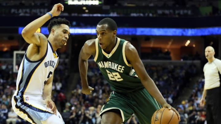 Jan 28, 2016; Memphis, TN, USA; Milwaukee Bucks forward Khris Middleton (22) dribbles in the second half as Memphis Grizzlies guard Courtney Lee (5) defends at FedExForum. Memphis defeated Milwaukee 103-83. Mandatory Credit: Nelson Chenault-USA TODAY Sports