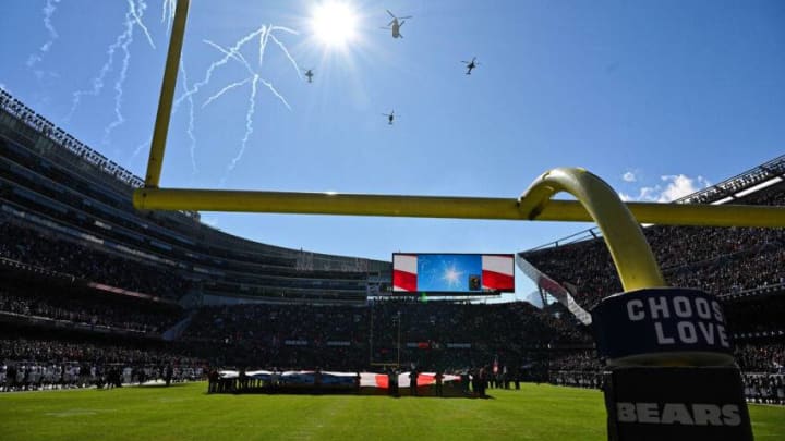 Oct 22, 2023; Chicago, Illinois, USA; Military helicopters fly over as the U.S. National Anthem is sung before a NFL game between the Las Vegas Raiders and the Chicago Bears at Soldier Field. Mandatory Credit: Jamie Sabau-USA TODAY Sports