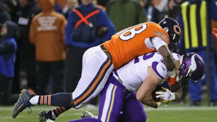 CHICAGO, IL - NOVEMBER 18: Roquan Smith #58 of the Chicago Bears brings down Kyle Rudolph #82 of the Minnesota Vikings at Soldier Field on November 18, 2018 in Chicago, Illinois. The Bears defeated the Vikings 25-20. (Photo by Jonathan Daniel/Getty Images)