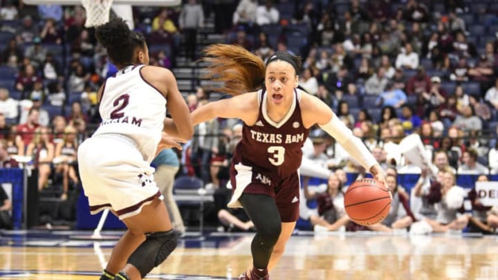 NASHVILLE, TN - MARCH 03: Texas A&M Aggies guard Chennedy Carter (3) dribbles the ball as m2 guards during the third period between the Mississippi State Lady Bulldogs and the Texas A&M Aggies in the SEC Women's Tournament on March 3, 2018, at the Bridgestone Arena in Nashville, TN. (Photo by Steve Roberts/Icon Sportswire via Getty Images)