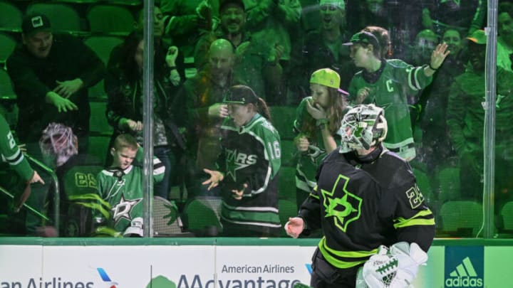 Jan 21, 2023; Dallas, Texas, USA; Dallas Stars goaltender Jake Oettinger (29) throws a puck to the Stars fans after he is named the number two star in the victory over the Arizona Coyotes at the American Airlines Center. Mandatory Credit: Jerome Miron-USA TODAY Sports