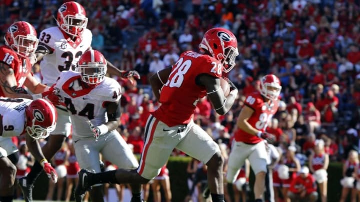 Apr 16, 2016; Athens, GA, USA; Georgia Bulldogs running back Shaquery Wilson (28) runs for a touchdown during the second half of the spring game at Sanford Stadium. The Black team defeated the Red team 34-14. Mandatory Credit: Brett Davis-USA TODAY Sports