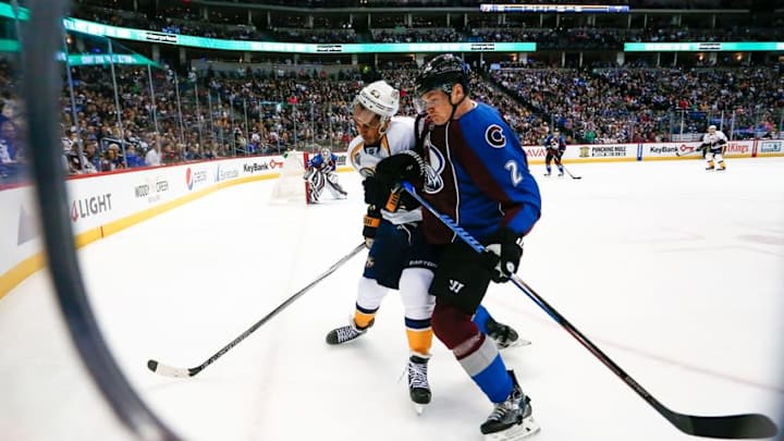 Mar 5, 2016; Denver, CO, USA; Nashville Predators center Mike Ribeiro (63) and Colorado Avalanche defenseman Nick Holden (2) battle for the puck in the first period at the Pepsi Center. Mandatory Credit: Isaiah J. Downing-USA TODAY Sports