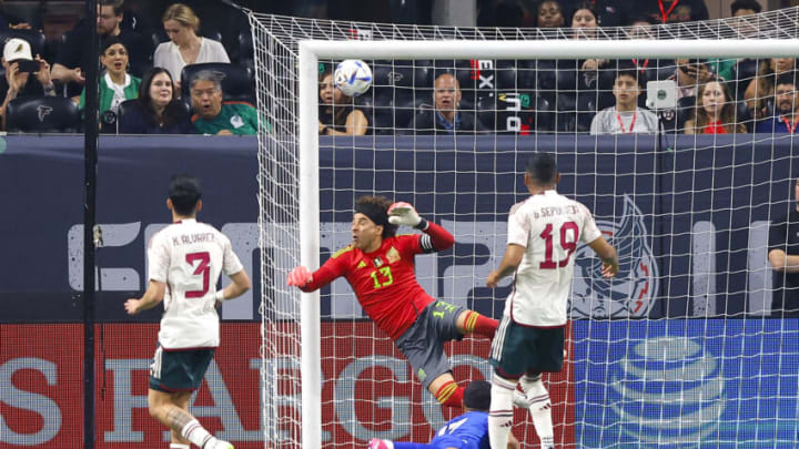 Mexico skipper Memo Ochoa (in red) did not have a good night against Uzbekistan. The El Tri goalie allowed three goals against the world's No. 74 ranked team. (Photo by Todd Kirkland/Getty Images)