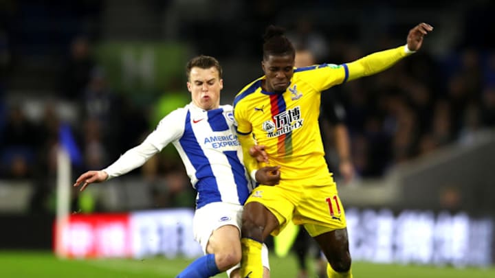 BRIGHTON, ENGLAND - DECEMBER 04: Wilfried Zaha of Crystal Palace is challenged by Solomon March of Brighton and Hove Albion during the Premier League match between Brighton & Hove Albion and Crystal Palace at American Express Community Stadium on December 4, 2018 in Brighton, United Kingdom. (Photo by Bryn Lennon/Getty Images)