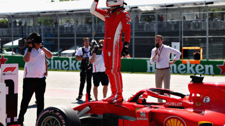 MONTREAL, QC - JUNE 09: Pole position qualifier Sebastian Vettel of Germany and Ferrari celebrates in parc ferme during qualifying for the Canadian Formula One Grand Prix at Circuit Gilles Villeneuve on June 9, 2018 in Montreal, Canada. (Photo by Dan Istitene/Getty Images)
