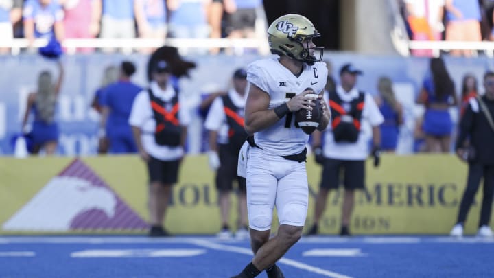 Sep 9, 2023; Boise, Idaho, USA; UCF Knights quarterback John Rhys Plumlee (10) drops back to pass during the first half of play versus the Boise State Broncos at Albertsons Stadium. Mandatory Credit: Brian Losness-USA TODAY Sports
