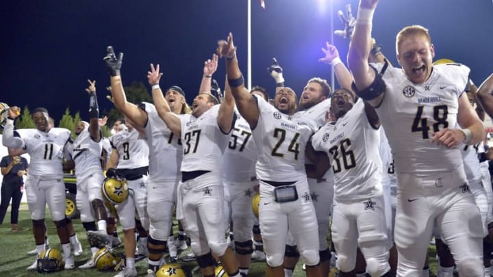 Sep 24, 2016; Bowling Green, KY, USA; Vanderbilt Commodores players celebrate after a NCAA football game against the Western Kentucky Hilltoppers at Houchens Industries-L.T. Smith Stadium. Vanderbilt defeated WKU 31-30 in overtime. Mandatory Credit: Jim Brown-USA TODAY Sports