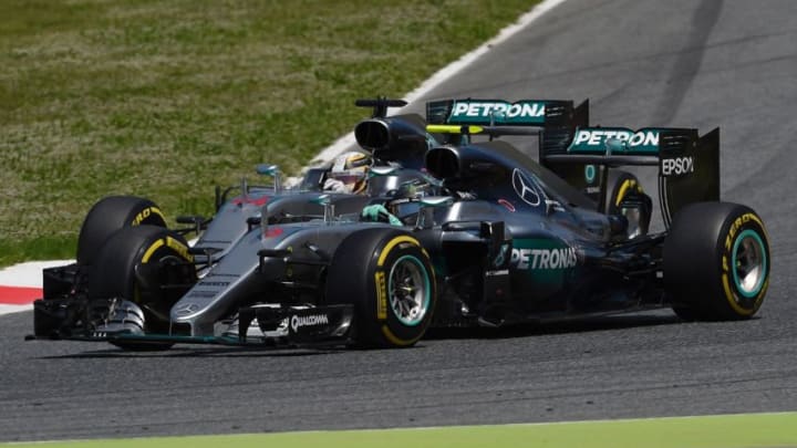 Lewis Hamilton and Nico Rosberg, Mercedes, Formula 1 (Photo by LLUIS GENE/AFP via Getty Images)