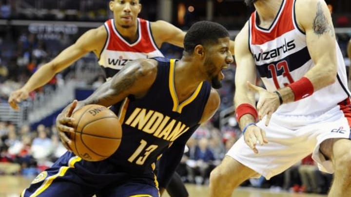 Nov 24, 2015; Washington, DC, USA; Indiana Pacers forward Paul George (13) dribbles as Washington Wizards center Marcin Gortat (13) defends during the second half at Verizon Center. Indiana Pacers won 123 – 106. Mandatory Credit: Brad Mills-USA TODAY Sports