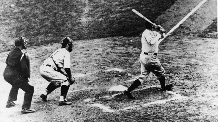 Legendary American baseball player Babe Ruth (1895 – 1948) of the New York Yankees hits a home run in the third game of the World Series against the Chicago Cubs at Wrigley Field, Chicago, October 1, 1932. It was during this game that Ruth gestured with his bat before hitting a home run giving birth to the legend of the ‘Called Shot.’ (Photo by B. Bennett/Getty Images)