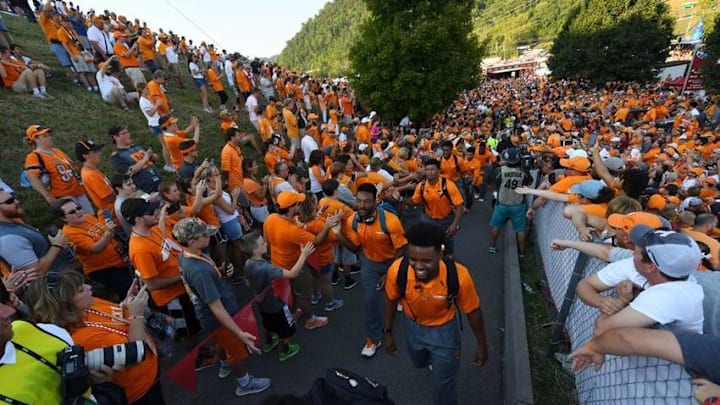 Sep 10, 2016; Bristol, TN, USA; Tennessee Volunteers players walk through fans during Vol Walk prior to the Battle at Bristol against the Virginia Tech Hokies at Bristol Motor Speedway. Mandatory Credit: Christopher Hanewinckel-USA TODAY Sports