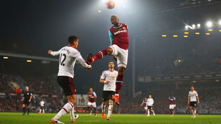 LONDON, ENGLAND - MAY 10: Diafra Sakho of West Ham United and Chris Smalling of Manchester United battle for the ball during the Barclays Premier League match between West Ham United and Manchester United at the Boleyn Ground on May 10, 2016 in London, England. West Ham United are playing their last ever home match at the Boleyn Ground after their 112 year stay at the stadium. The Hammers will move to the Olympic Stadium for the 2016-17 season. (Photo by Paul Gilham/Getty Images)