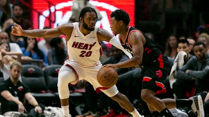 Toronto Raptors guard Kyle Lowry (7) fights to get past Miami Heat forward Justise Winslow (20) (Matias J. Ocner/Miami Herald/Tribune News Service via Getty Images)
