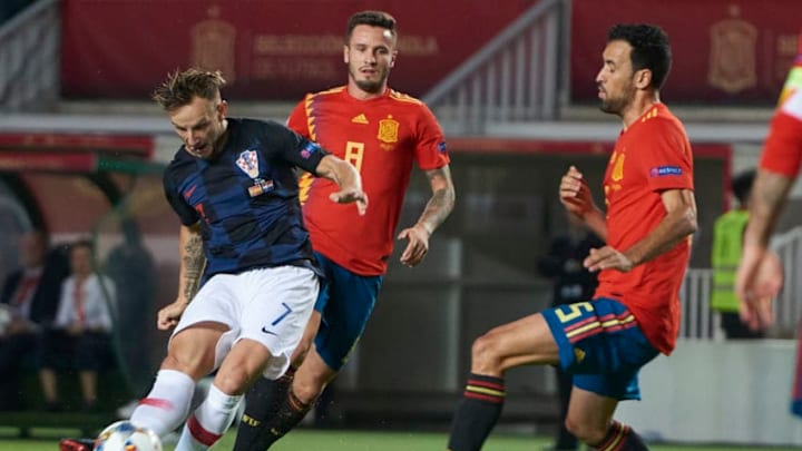 ELCHE, SPAIN - SEPTEMBER 11: Ivan Rakitik midfielder of Croatia shoot the ball front of Sergio Busquets midfielder of Spain during the UEFA Nations League A Group four match between Spain and Croatia on September 11, 2018, at Estadio Manuel Martinez Valero in Elche, Spain. (Photo by Carlos Sanchez Martinez/Icon Sportswire via Getty Images)