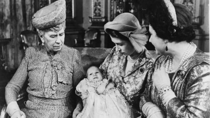 Portrait of then-Princess Elizabeth holding her daughter, Princess Anne, with the grandmothers Queen Mary (left) and Queen Elizabeth, following the christening in October 1950.