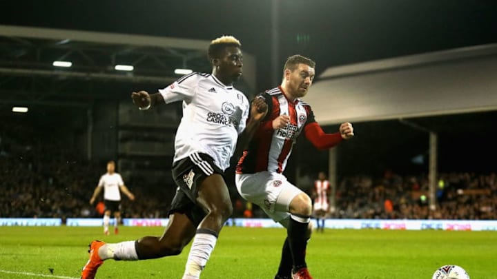LONDON, ENGLAND - MARCH 06: Sheyi Ojo of Fulham and Jack O'Connell of Sheffield United in action during the Sky Bet Championship match between Fulham and Sheffield United at Craven Cottage on March 6, 2018 in London, England. (Photo by Alex Pantling/Getty Images)