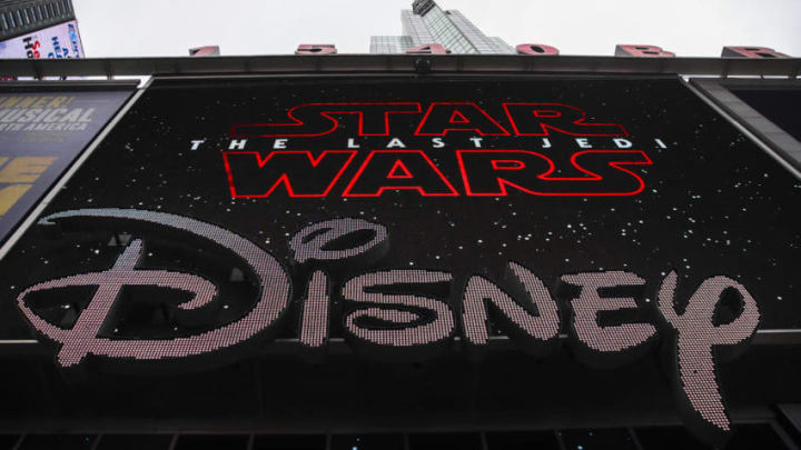 NEW YORK, NY - DECEMBER 14: The Disney logo is displayed outside the Disney Store in Times Square, December 14, 2017 in New York City. The Walt Disney Company announced on Thursday morning that it had reached a deal to purchase most of the assets of 21st Century Fox. The deal has a total value of around $66 billion, with Disney assuming $13.7 billion of Fox's net debt. (Photo by Drew Angerer/Getty Images)