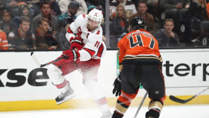 ANAHEIM, CALIFORNIA – OCTOBER 18: Jordan Staal #11 of the Carolina Hurricanes shoots the puck past Hampus Lindholm #47 of the Anaheim Ducks during the second period of a game at Honda Center on October 18, 2019, in Anaheim, California. (Photo by Sean M. Haffey/Getty Images)