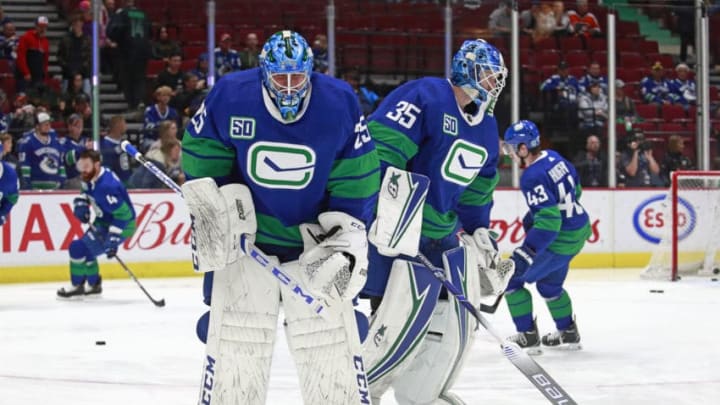 VANCOUVER, BC - OCTOBER 12: Thatcher Demko #35 and Jacob Markstrom #25 of the Vancouver Canucks skate up the ice during warmup before their NHL game against the Philadelphia Flyers at Rogers Arena October 12, 2019 in Vancouver, British Columbia, Canada. (Photo by Jeff Vinnick/NHLI via Getty Images)