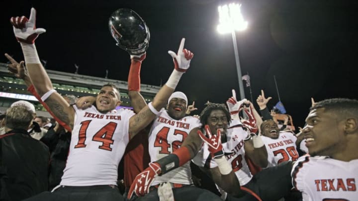 NORMAN, OK - OCTOBER 22: Texas Tech players celebrate after the game against the Oklahoma Sooners October 22, 2011 at Gaylord Family-Oklahoma Memorial Stadium in Norman, Oklahoma. Texas Tech upset Oklahoma 41-38. (Photo by Brett Deering/Getty Images)