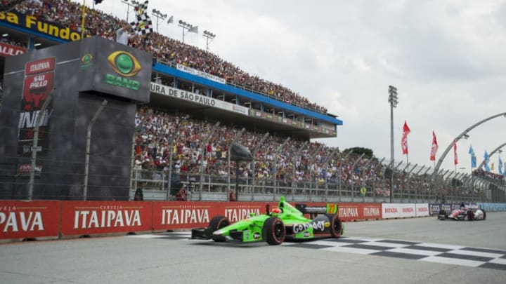 SAO PAULO, BRAZIL - MAY 5: James Hinchcliffe of Canada driver of the #27 Andretti Autosport Dallara Chevrolet crosses the finish line in first place ahead of Takuma Sato of Japan driver of the #14 ABC Supply A. J. Foyt Racing Dallara Honda the IndyCar Series Sao Paulo indy 300 on May 5, 2013 in the streets of Sao Paulo in Sao Paulo, Brazil. (Photo by Robert Laberge/Getty Images)