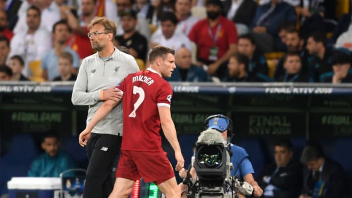 KIEV, UKRAINE - MAY 26: James Milner of Liverpool embraces Jurgen Klopp during the UEFA Champions League Final between Real Madrid and Liverpool at NSC Olimpiyskiy Stadium on May 26, 2018 in Kiev, Ukraine. (Photo by Laurence Griffiths/Getty Images)