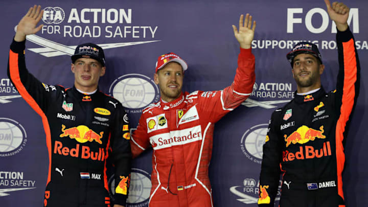 SINGAPORE - SEPTEMBER 16: Top three qualifiers Sebastian Vettel of Germany and Ferrari, Max Verstappen of Netherlands and Red Bull Racing and Daniel Ricciardo of Australia and Red Bull Racing in parc ferme during qualifying for the Formula One Grand Prix of Singapore at Marina Bay Street Circuit on September 16, 2017 in Singapore. (Photo by Mark Thompson/Getty Images)