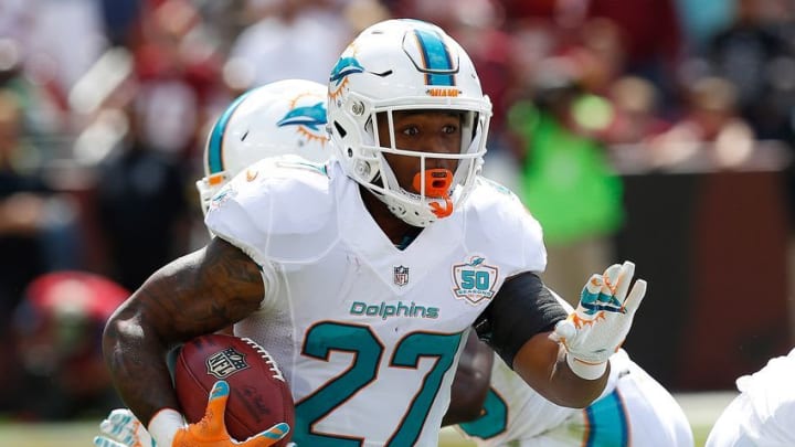 Sep 13, 2015; Landover, MD, USA; Miami Dolphins running back LaMichael James (27) carries the ball against the Washington Redskins at FedEx Field. Mandatory Credit: Geoff Burke-USA TODAY Sports