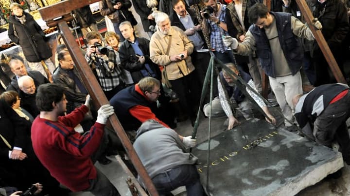Archeologists lift Tycho Brahe's tombstone in Prague in 2010.