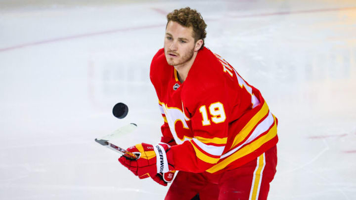 Apr 16, 2022; Calgary, Alberta, CAN; Calgary Flames left wing Matthew Tkachuk (19) controls the puck during the warmup period against the Arizona Coyotes at Scotiabank Saddledome. Mandatory Credit: Sergei Belski-USA TODAY Sports