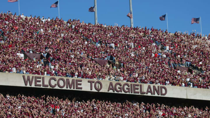 COLLEGE STATION, TX - NOVEMBER 6: Texas A&M University Aggies fans, sometimes referred to as the 12th Man, watch the game against the University of Oklahoma Sooners on November 6, 2004 at Kyle Field in College Station, Texas. The Sooners defeated the Aggies 42-35. (Photo by Ronald Martinez/Getty Images)