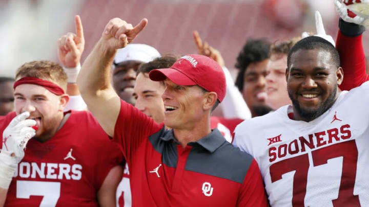NORMAN, OK - APRIL 23: Head coach Brent Venables of the Oklahoma Sooners stands with his team for the alma mater during their spring game at Gaylord Family Oklahoma Memorial Stadium on April 23, 2022 in Norman, Oklahoma. (Photo by Brian Bahr/Getty Images)