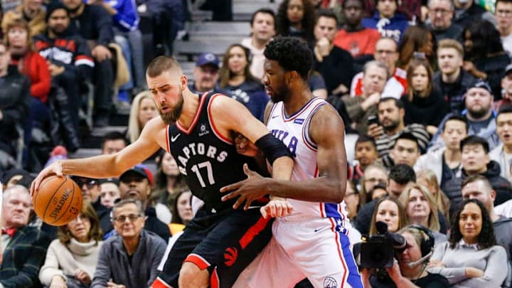 TORONTO, ON - DECEMBER 23 - Jonas Valenciunas of the Raptors tries to get past Joel Embiid of the 76ers during the 1st half of NBA action as the Toronto Raptors host the Philadelphia 76ers at the Air Canada Centre on December 23, 2017. (Carlos Osorio/Toronto Star via Getty Images)