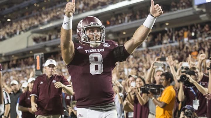 Oct 8, 2016; College Station, TX, USA; Texas A&M Aggies quarterback Trevor Knight (8) celebrates after scoring the game winning touchdown during the second overtime against the Tennessee Volunteers at Kyle Field. The Aggies defeated the Volunteers 45-38 in overtime. Mandatory Credit: Jerome Miron-USA TODAY Sports