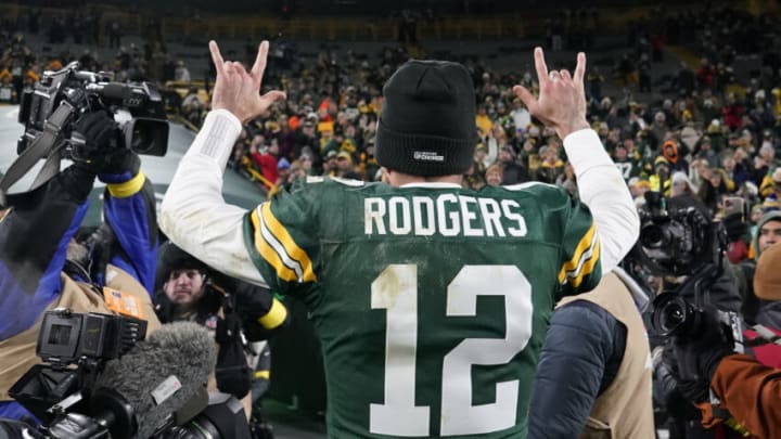 GREEN BAY, WISCONSIN - DECEMBER 19: Aaron Rodgers #12 of the Green Bay Packers walks off the field after defeating the Los Angeles Rams 24-12 at Lambeau Field on December 19, 2022 in Green Bay, Wisconsin. (Photo by Patrick McDermott/Getty Images)