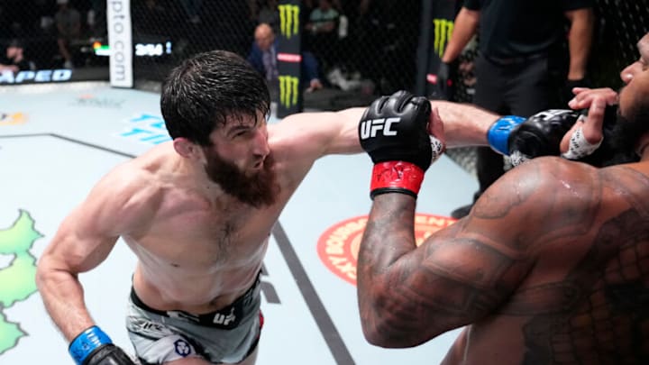 LAS VEGAS, NEVADA - MARCH 12: (L-R) Magomed Ankalaev of Russia punches Thiago Santos of Brazil in their light heavyweight fight during the UFC Fight Night event at UFC APEX on March 12, 2022 in Las Vegas, Nevada. (Photo by Chris Unger/Zuffa LLC)