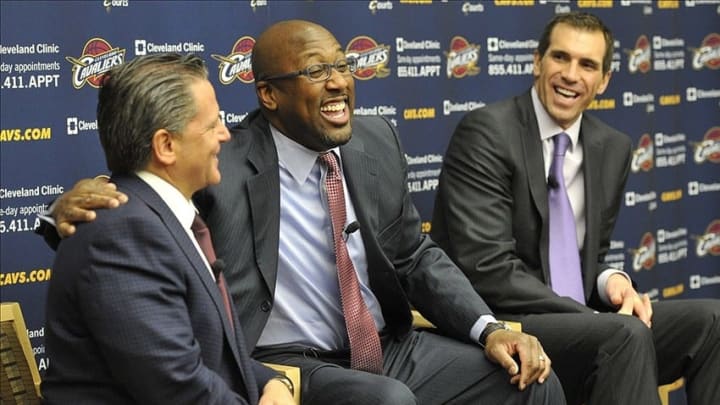 Apr 24, 2013; Independence, OH, USA; Cleveland Cavaliers general manager Chris Grant (right) watches as new head coach Mike Brown (center) puts his arm around team owner Dan Gilbert during a press conference at Cleveland Clinic Courts. Mandatory Credit: David Richard-USA TODAY Sports