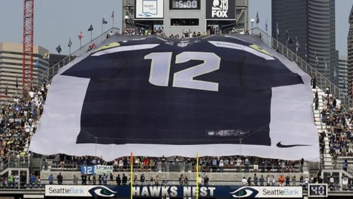 Sept 16, 2012; Seattle, WA, USA; Seattle Seahawks fans above the north end zone of CenturyLink Field unfurl a banner before kickoff against the Dallas Cowboys. Mandatory Credit: Joe Nicholson-USA TODAY Sports