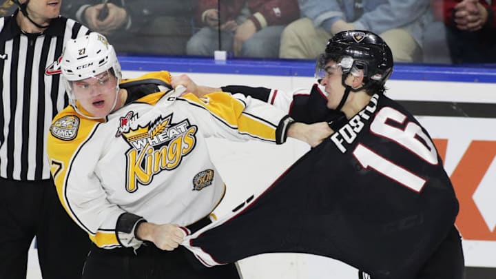 LANGLEY, BC - DECEMBER 2: Thomas Foster #16 of the Vancouver Giants fights Reid Duke #27 of the Brandon Wheat Kings during the third period of their WHL game at the Langley Events Centre on December 2, 2016 in Langley, British Columbia, Canada. (Photo by Ben Nelms/Getty Images)
