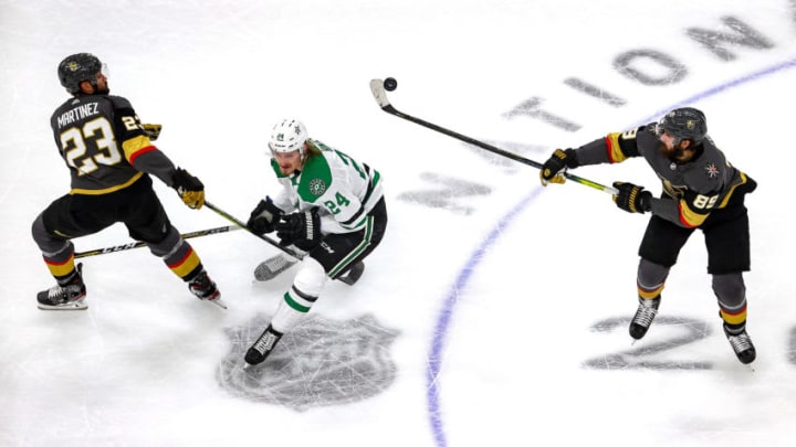Alex Tuch #89 of the Vegas Golden Knights handles the puck against Roope Hintz #24 of the Dallas Stars as Alec Martinez #23 looks on during the first period in Game Five of the Western Conference Final. (Photo by Bruce Bennett/Getty Images)