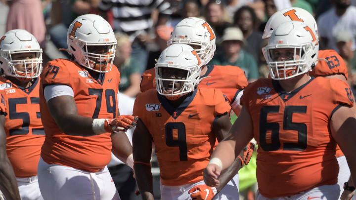 CHAMPAIGN, IL. – SEPTEMBER 14: Illinois players celebrate after Illinois wide receiver Josh Imatorbhebhe (9) scored the tying touchdown late in the game during a non-conference college football game between the Eastern Michigan Eagles and the Illinois Fighting Illini on September 14, 2019, at Memorial Stadium, Champaign, IL. (Photo by Keith Gillett/Icon Sportswire via Getty Images)