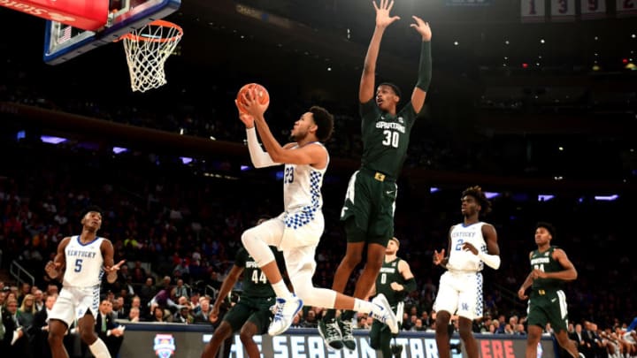 NEW YORK, NEW YORK - NOVEMBER 05: EJ Montgomery #23 of the Kentucky Wildcats drives past Marcus Bingham Jr. #30 of the Michigan State Spartans for a basket in the first half of their game at Madison Square Garden on November 05, 2019 in New York City. (Photo by Emilee Chinn/Getty Images)
