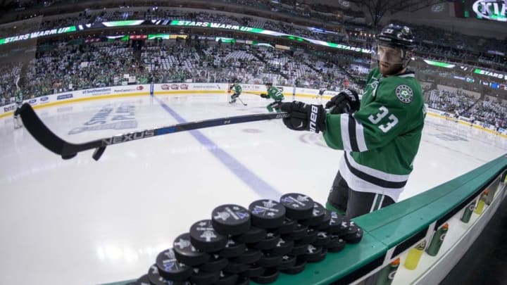 May 1, 2016; Dallas, TX, USA; Dallas Stars defenseman Alex Goligoski (33) hits the warmup pucks on to the ice before the game between the Stars and the St. Louis Blues in game two of the first round of the 2016 Stanley Cup Playoffs at the American Airlines Center. Mandatory Credit: Jerome Miron-USA TODAY Sports