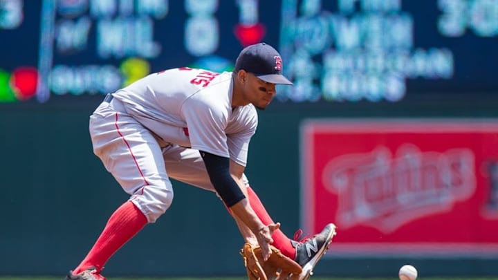 Jun 12, 2016; Minneapolis, MN, USA; Boston Red Sox shortstop Xander Bogaerts (2) fields a ground ball in the first inning against the Minnesota Twins at Target Field. Mandatory Credit: Brad Rempel-USA TODAY Sports