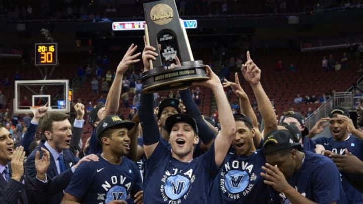 College Basketball: NCAA Playoffs: Villanova Ryan Arcidiacono (15) victorious, holding up South Regional Championship trophy with teammates after winning game vs Kansas at KFC YUM! Center.Louisville, KY 3/26/2016CREDIT: Greg Nelson (Photo by Greg Nelson /Sports Illustrated/Getty Images)(Set Number: SI-296 TK1 )