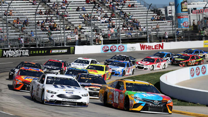MARTINSVILLE, VA - APRIL 02: Kyle Busch, driver of the #18 M&M's Toyota, and Brad Keselowski, driver of the #2 Miller Lite Ford, lead the field to green during a restart during the Monster Energy NASCAR Cup Series STP 500 at Martinsville Speedway on April 2, 2017 in Martinsville, Virginia. (Photo by Jerry Markland/Getty Images)