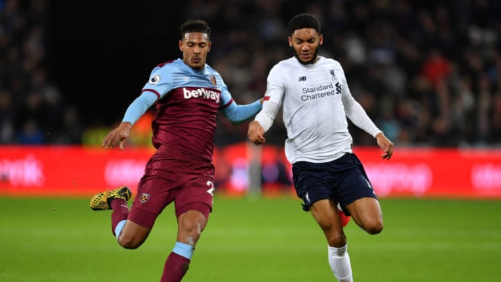 LONDON, ENGLAND - JANUARY 29: Joe Gomez of Liverpool is tackled by Sebastien Haller of West Ham United during the Premier League match between West Ham United and Liverpool FC at London Stadium on January 29, 2020 in London, United Kingdom. (Photo by Justin Setterfield/Getty Images)