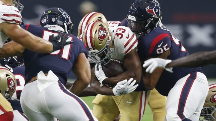 HOUSTON, TX - AUGUST 18: Tarvarus McFadden #33 of the San Francisco 49ers is tackled by Christian Covington #95 of the Houston Texans an Dylan Cole #51 during a preseason game at NRG Stadium on August 18, 2018 in Houston, Texas. (Photo by Bob Levey/Getty Images)